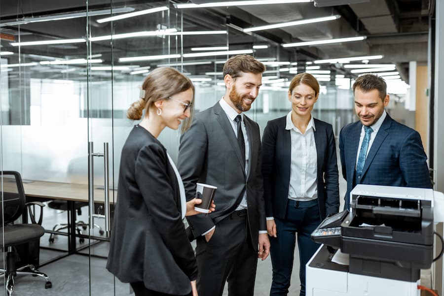 Group of office worker using a commercial printer