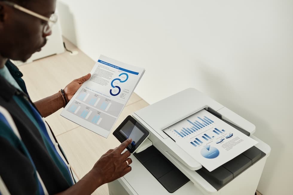 business owner using automatic collation on the photocopier