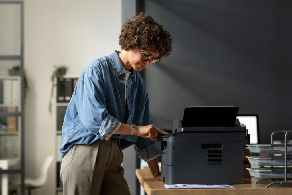 Woman is Troubleshooting common printer issues for smooth working