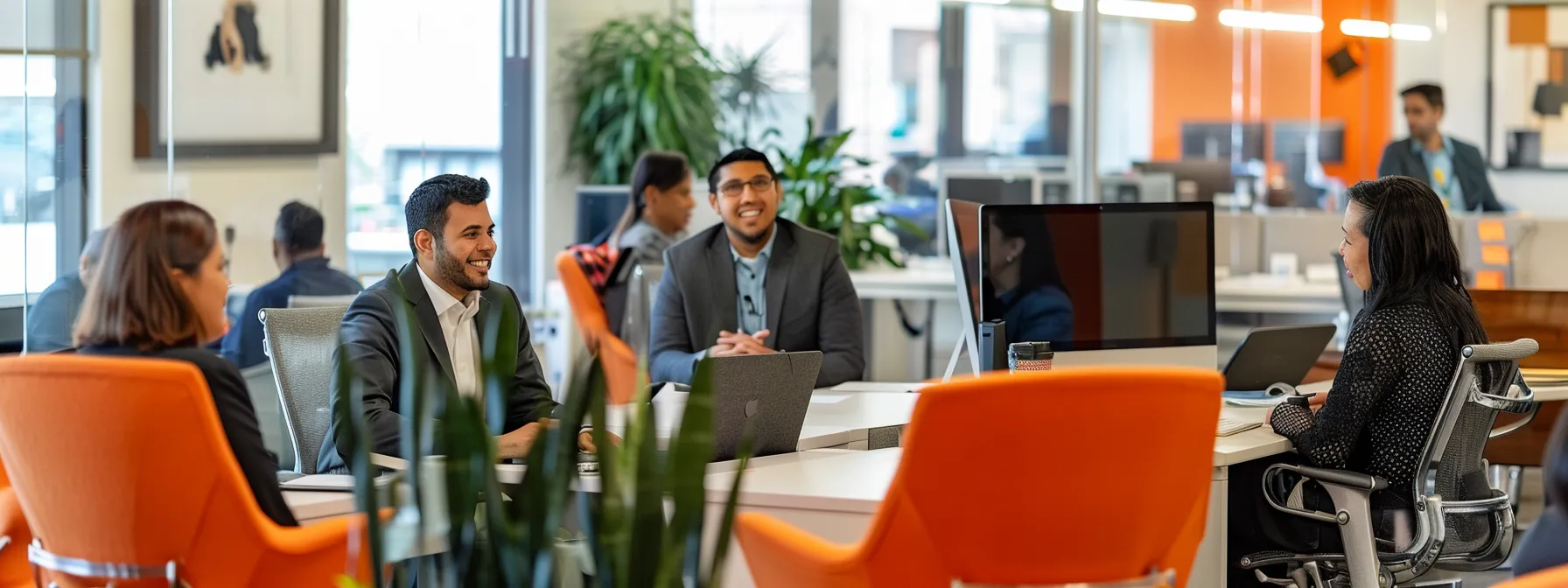 Mastering the MSP Business Model: A Practical Guide 13 a vibrant office environment showcases professionals engaging in meaningful conversations, with a backdrop of a welcoming help desk, highlighting the importance of strong client relationships and effective communication.