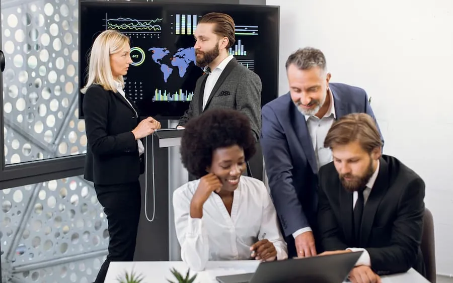 A team reviewing a roadmap on a big screen