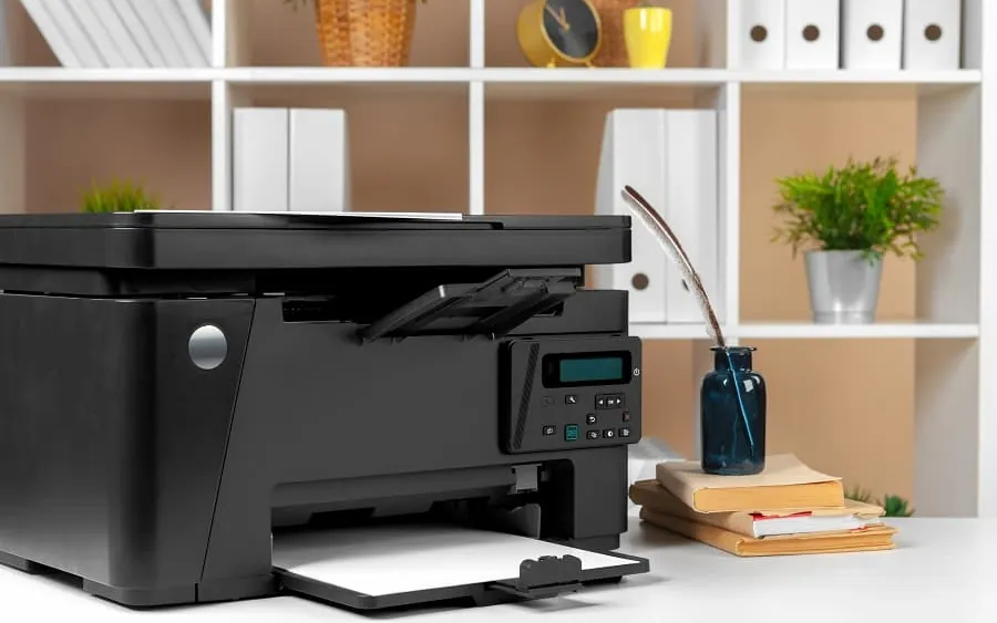 A multifunction printer on a tidy office desk