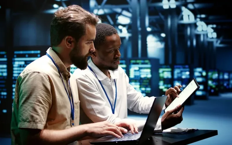 Coworkers running data center tests