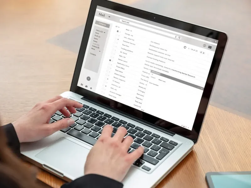 Email client list woman hand on the computer laptop